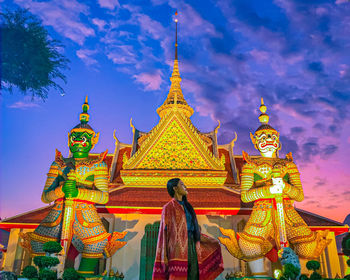 Low angle view of statue against building