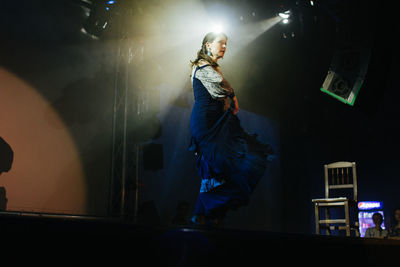 Full length of woman standing on stage