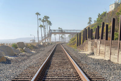 Railroad tracks against clear sky