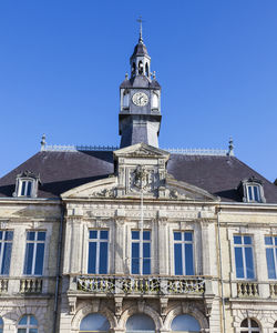 Low angle view of historic building against clear blue sky