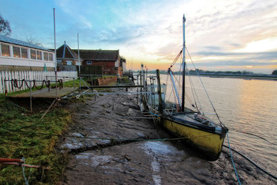 Boat on shore against sky