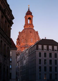 Low angle view of buildings against sky in city