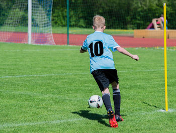 Man playing soccer on field