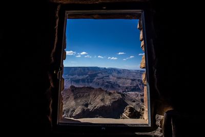 Scenic view of mountains seen through window