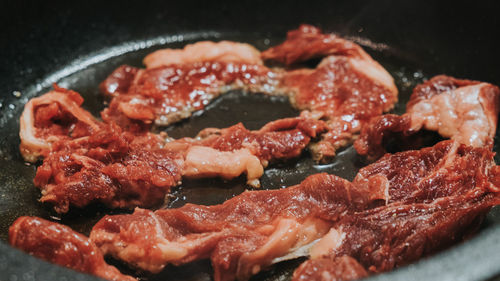 Close-up of meat in cooking utensil