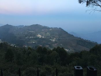 Scenic view of tree mountains against sky