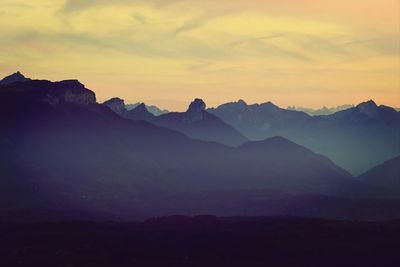 Scenic view of mountains against sky during sunset