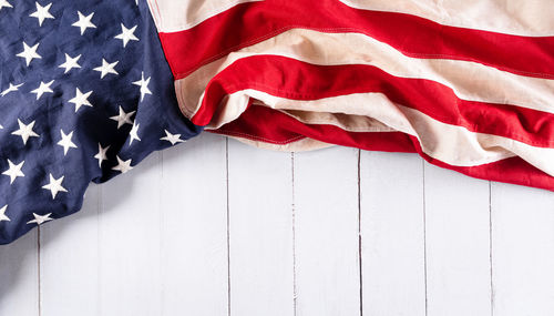 Low angle view of flag against blue sky