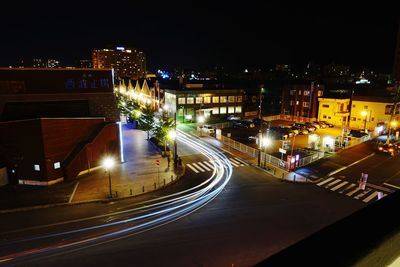 High angle view of light trails on road at night