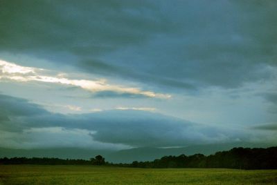 Scenic view of landscape against cloudy sky