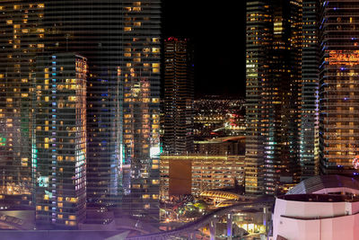 Illuminated buildings in city at night