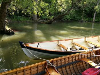 Boats moored in river