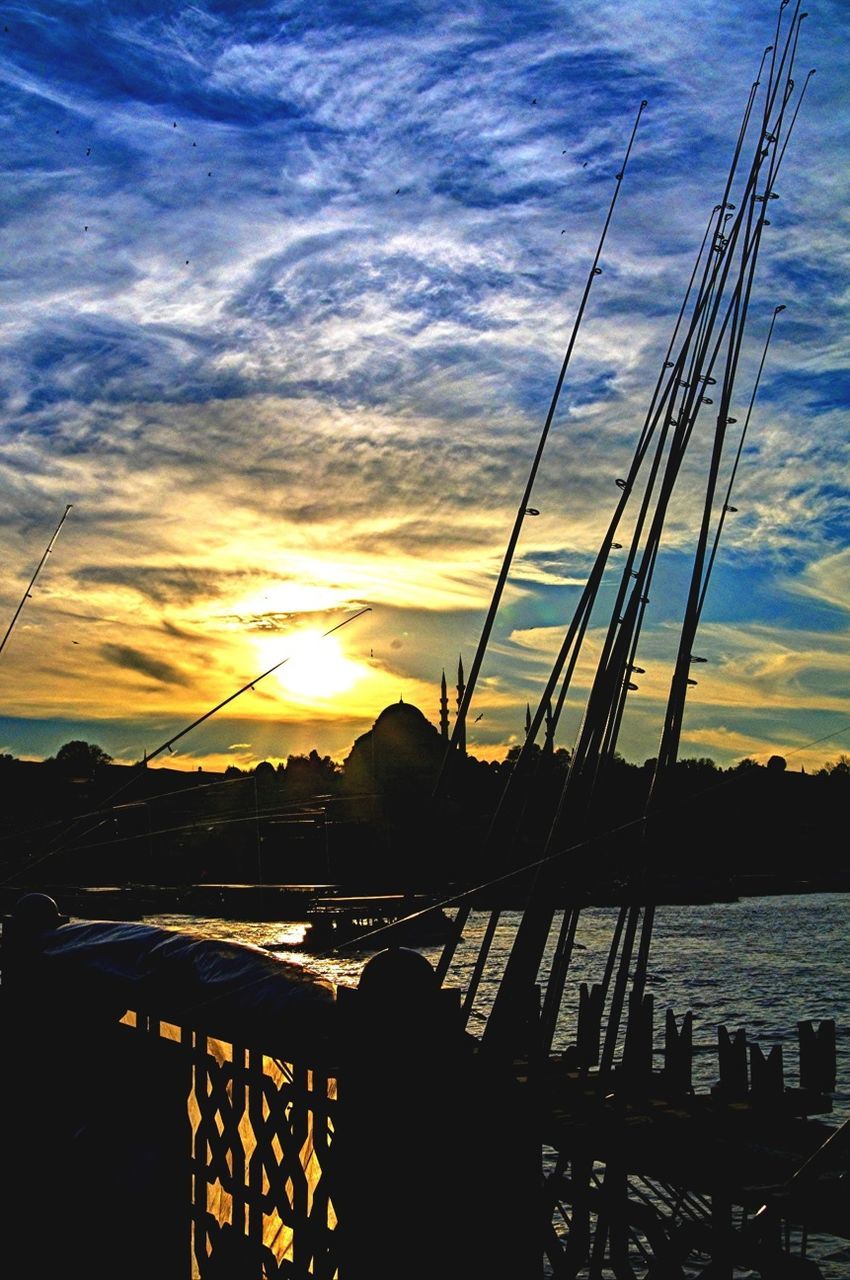 sunset, water, sky, nautical vessel, transportation, boat, moored, orange color, sea, sun, mode of transport, cloud - sky, silhouette, scenics, beauty in nature, reflection, tranquility, nature, mast, tranquil scene