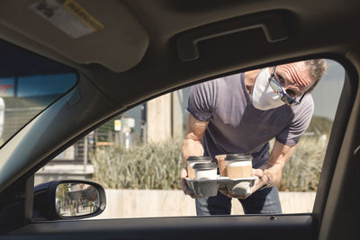 Take out coffee delivered to car window