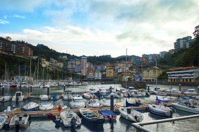 Boats moored at harbor