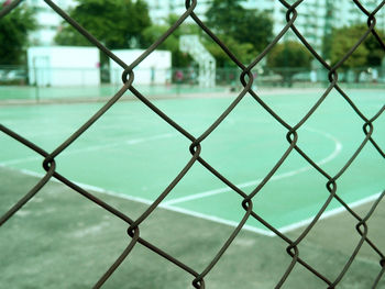 Full frame shot of chainlink fence against sky