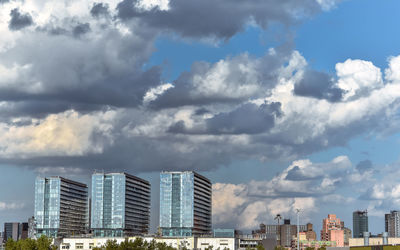 Modern buildings in city against sky