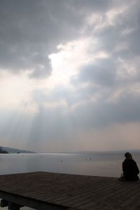 Scenic view of sea against cloudy sky