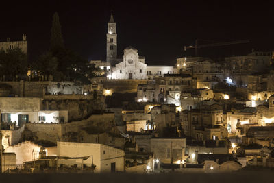 View of illuminated buildings in city at night