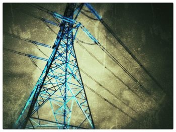 Low angle view of telephone pole against sky