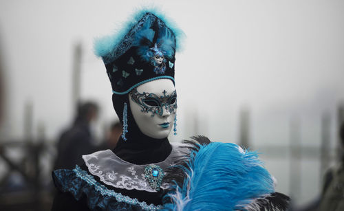 Close-up of woman wearing venetian mask at carnival