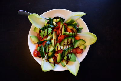 High angle view of chopped vegetables in bowl on table