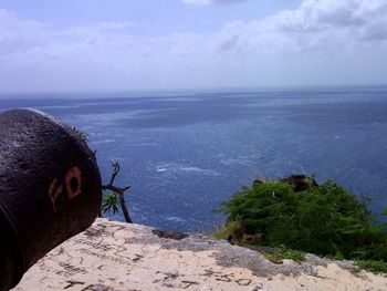 Scenic view of sea against cloudy sky