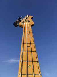 Low angle view of tower against blue sky