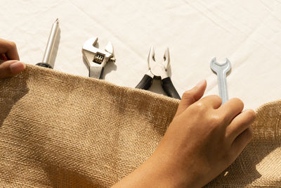 High angle view of person hand on table