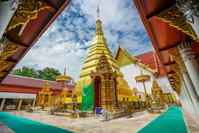 Low angle view of pagoda against buildings