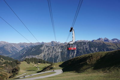 Overhead cable car against sky