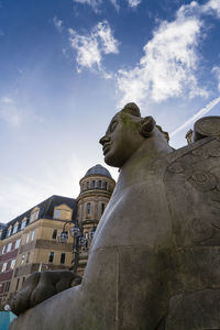 Low angle view of statue against sky