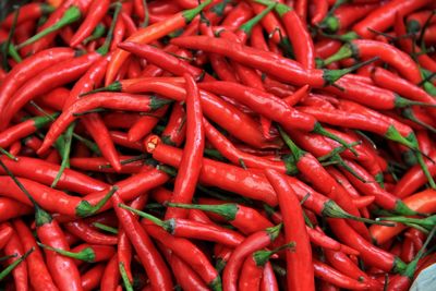 Full frame shot of red chili peppers for sale at market