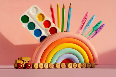 Close-up of multi colored pencils on table