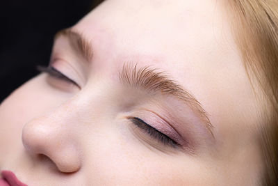 Close-up of woman with eyes closed