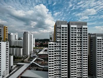 Modern buildings in city against sky