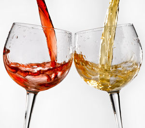 Close-up of beer glass against white background