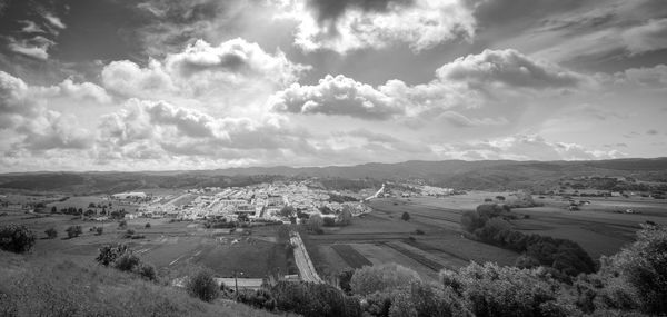 Scenic view of landscape against cloudy sky