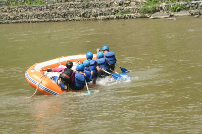 High angle view of people in boat on river