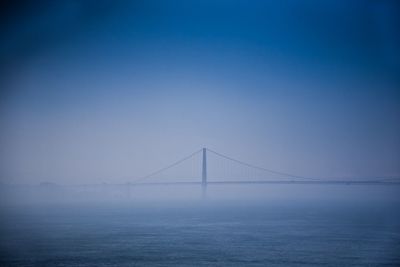 Suspension bridge in fog