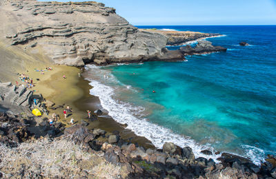 High angle view of rocks on beach against sky