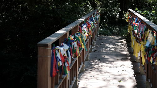 Multi colored umbrellas on railing