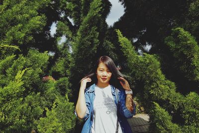 Portrait of a beautiful young woman in forest