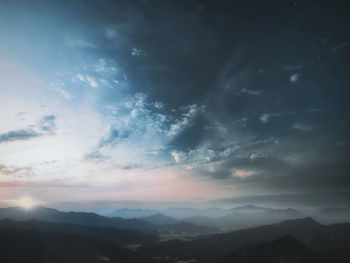 Scenic view of silhouette mountains against sky during sunset