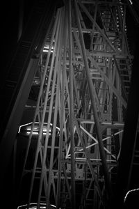 Low angle view of illuminated bridge at night