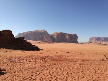 Scenic view of desert against clear sky