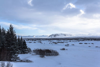 Scenic view of snowcapped mountains against sky