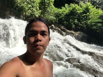 Portrait of shirtless man in water