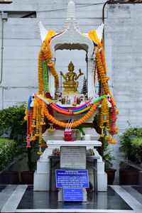 Statue of temple against building