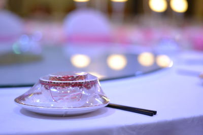 Close-up of packed food with chopsticks served on table at restaurant